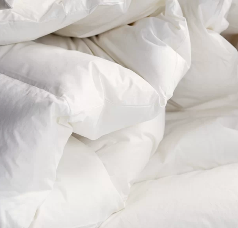 Image of a Novegr Down Duvet loosely stacked on its self.  